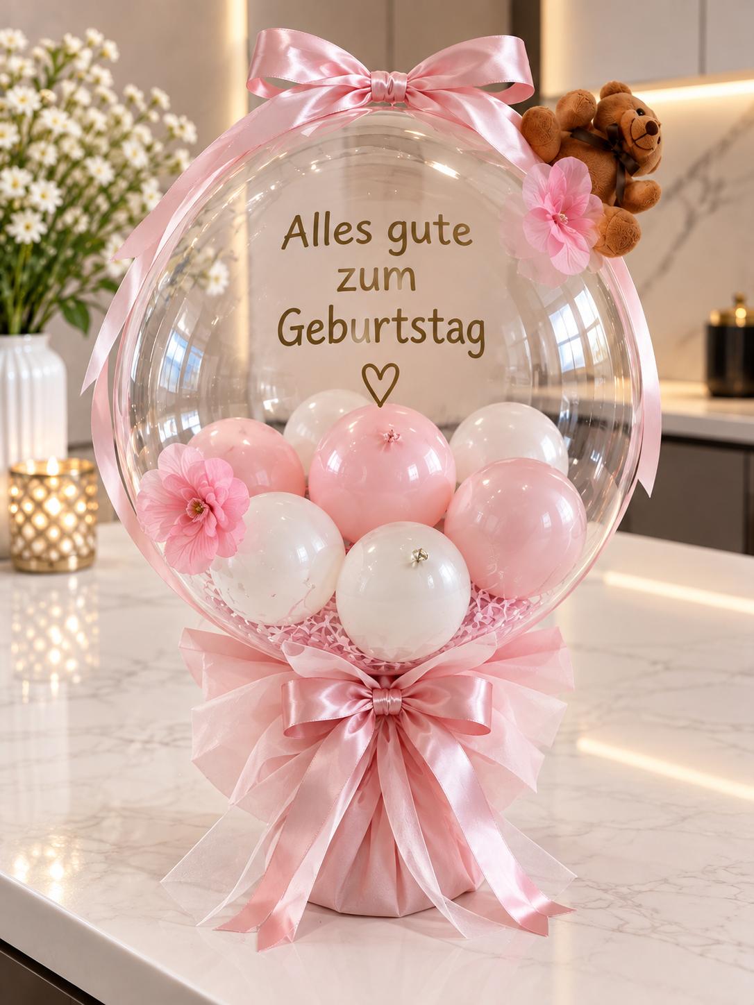 Bubble-Ballon mit rosa und weißen Ballons und Aufschrift Alles Gute zum Geburtstag